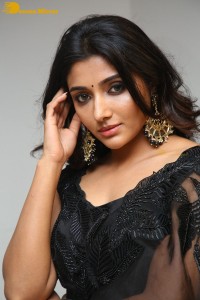Indian Actress Mirnaa Menon in a black dress