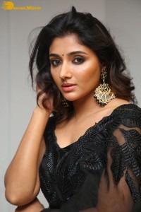 Indian Actress Mirnaa Menon in a black dress