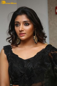 Indian Actress Mirnaa Menon in a black dress