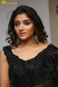 Indian Actress Mirnaa Menon in a black dress