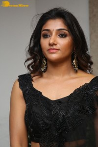 Indian Actress Mirnaa Menon in a black dress