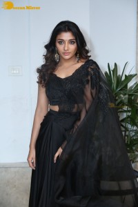 Indian Actress Mirnaa Menon in a black dress