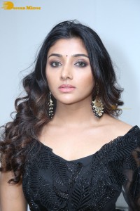 Indian Actress Mirnaa Menon in a black dress