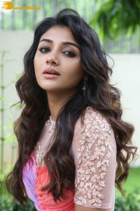 Indian Actress Mirnaa Menon in a pink dress