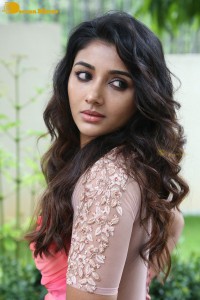 Indian Actress Mirnaa Menon in a pink dress