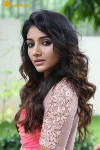 Indian Actress Mirnaa Menon in a pink dress