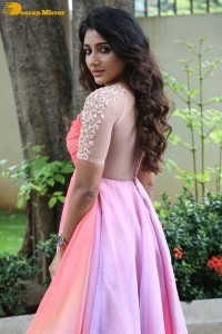 Indian Actress Mirnaa Menon in a pink dress