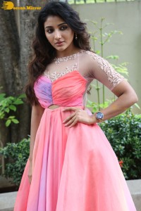 Indian Actress Mirnaa Menon in a pink dress