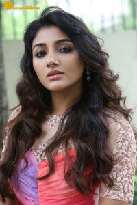 Indian Actress Mirnaa Menon in a pink dress