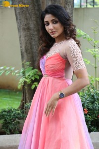Indian Actress Mirnaa Menon in a pink dress