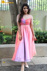 Indian Actress Mirnaa Menon in a pink dress