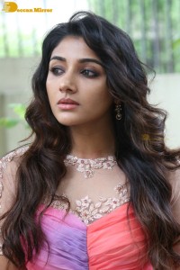 Indian Actress Mirnaa Menon in a pink dress