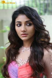 Indian Actress Mirnaa Menon in a pink dress