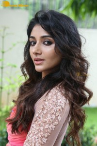 Indian Actress Mirnaa Menon in a pink dress