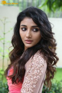 Indian Actress Mirnaa Menon in a pink dress