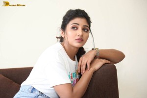 Actress mirnaa in a white top and denim skirt