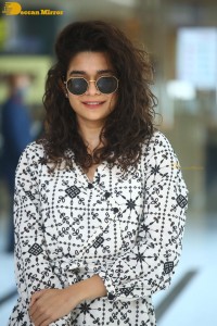 Indian actress Mithila Palkar in a black and white dress