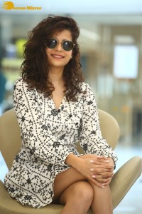 Indian actress Mithila Palkar in a black and white dress