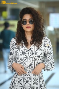 Indian actress Mithila Palkar in a black and white dress