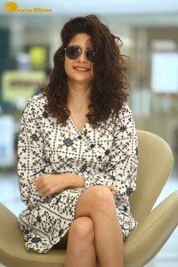 Indian actress Mithila Palkar in a black and white dress