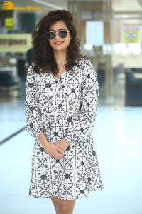Indian actress Mithila Palkar in a black and white dress