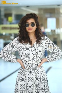 Indian actress Mithila Palkar in a black and white dress