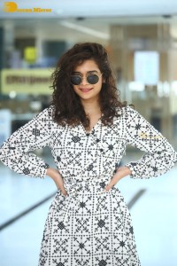 Indian actress Mithila Palkar in a black and white dress