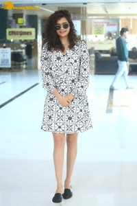 Indian actress Mithila Palkar in a black and white dress