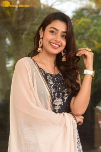 Telugu Film Actress Mokksha in a black salwar kameez dress