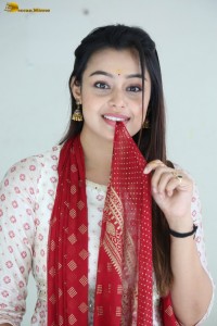 actress moksha cute in a white salwar dress