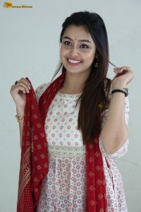 actress moksha cute in a white salwar dress
