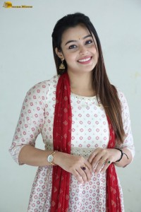 actress moksha cute in a white salwar dress