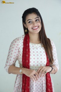 actress moksha cute in a white salwar dress