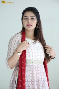 actress moksha cute in a white salwar dress
