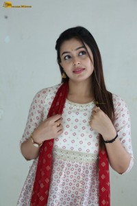 actress moksha cute in a white salwar dress