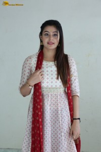 actress moksha cute in a white salwar dress