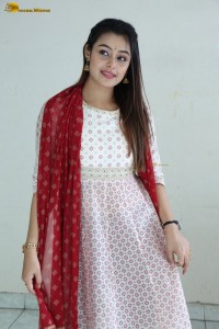 actress moksha cute in a white salwar dress