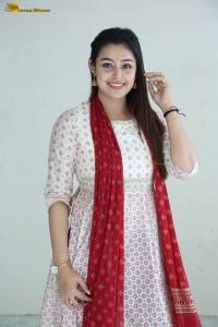 actress moksha cute in a white salwar dress