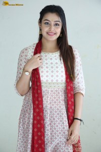 actress moksha cute in a white salwar dress