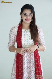 actress moksha cute in a white salwar dress