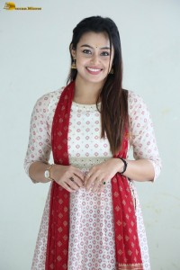 actress moksha cute in a white salwar dress