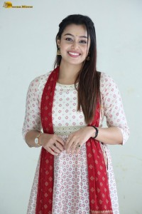 actress moksha cute in a white salwar dress
