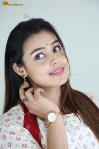 actress moksha cute in a white salwar dress