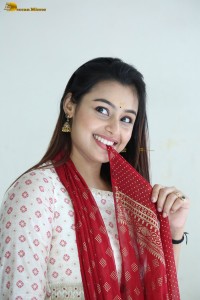 actress moksha cute in a white salwar dress