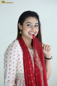 actress moksha cute in a white salwar dress