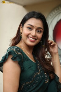 actress Mokksha cute in a green saree