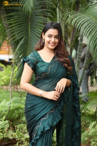 actress Mokksha cute in a green saree
