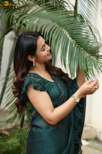 actress Mokksha cute in a green saree