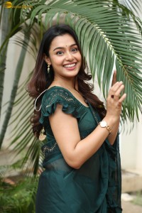 actress Mokksha cute in a green saree
