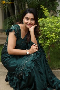 actress Mokksha cute in a green saree